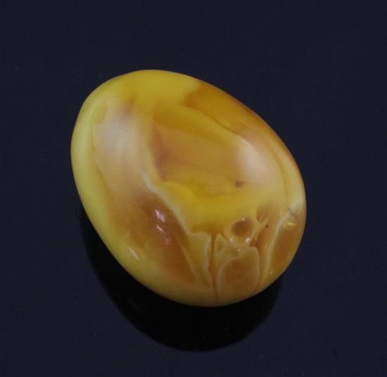 A piece of egg shaped amber, approx. 42mm.